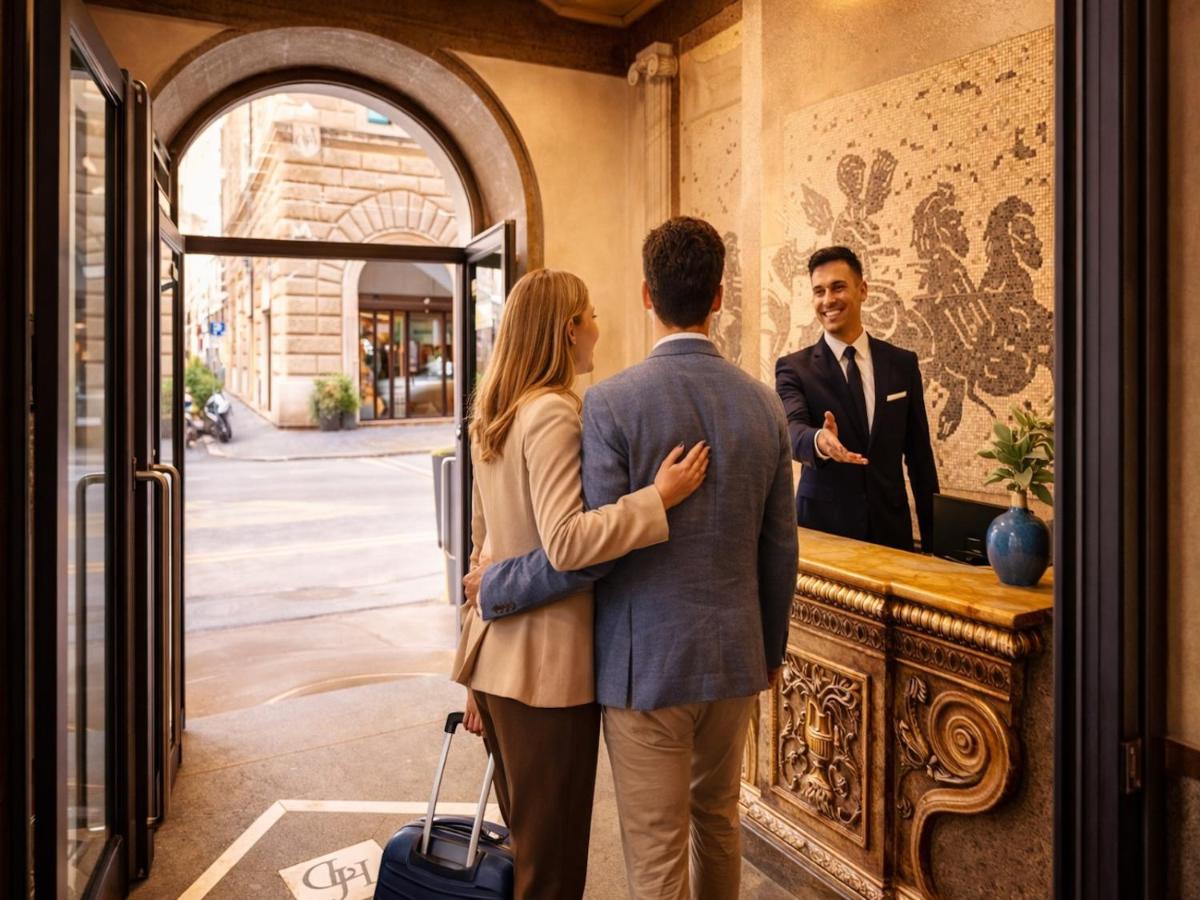 Een man en een vrouw staan voor een toonbank. bij Hotel Diplomatic in Rome