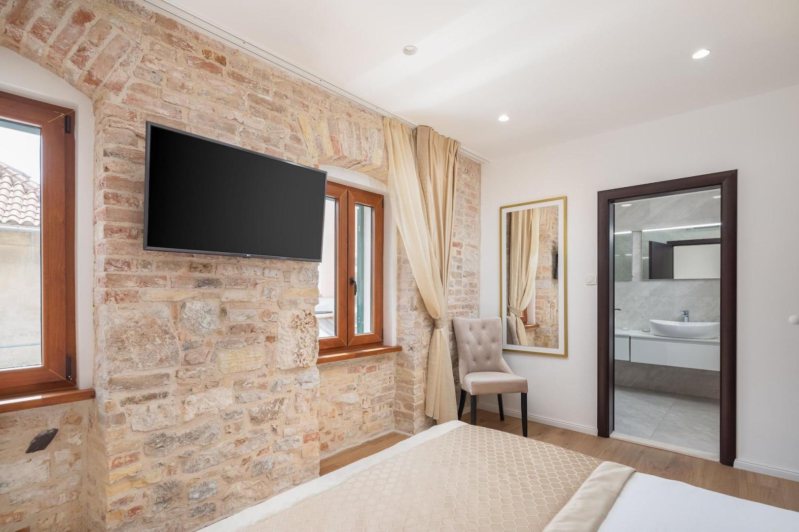 Suite met zithoek — Le Premier Rooms