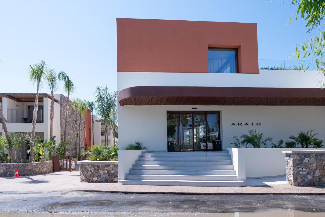 een gevel van een gebouw met trappen en palmbomen bij ARATO by E-GEO, Adults Only in Kos-stad