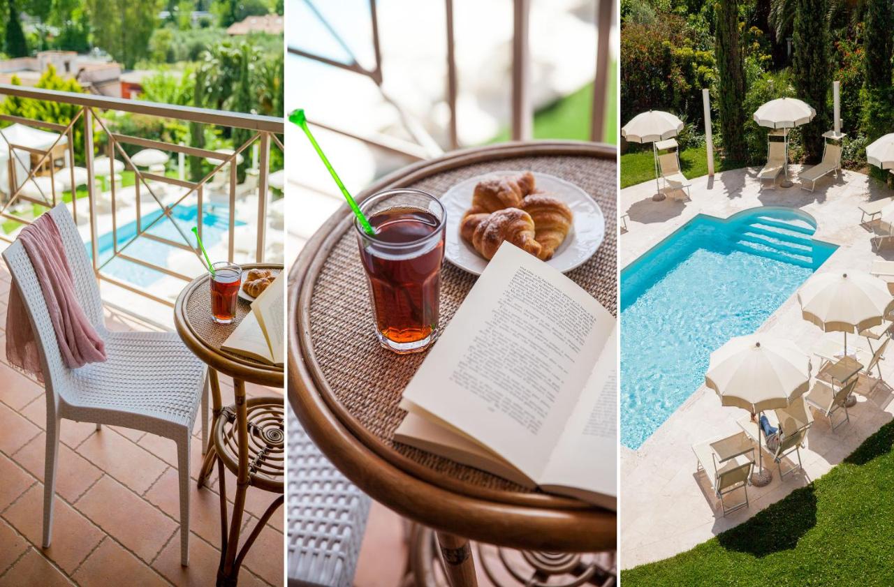 een tafel met een boek, een drankje en een bord eten bij Ostia Antica Park Hotel & Spa in Ostia Antica +69 foto's