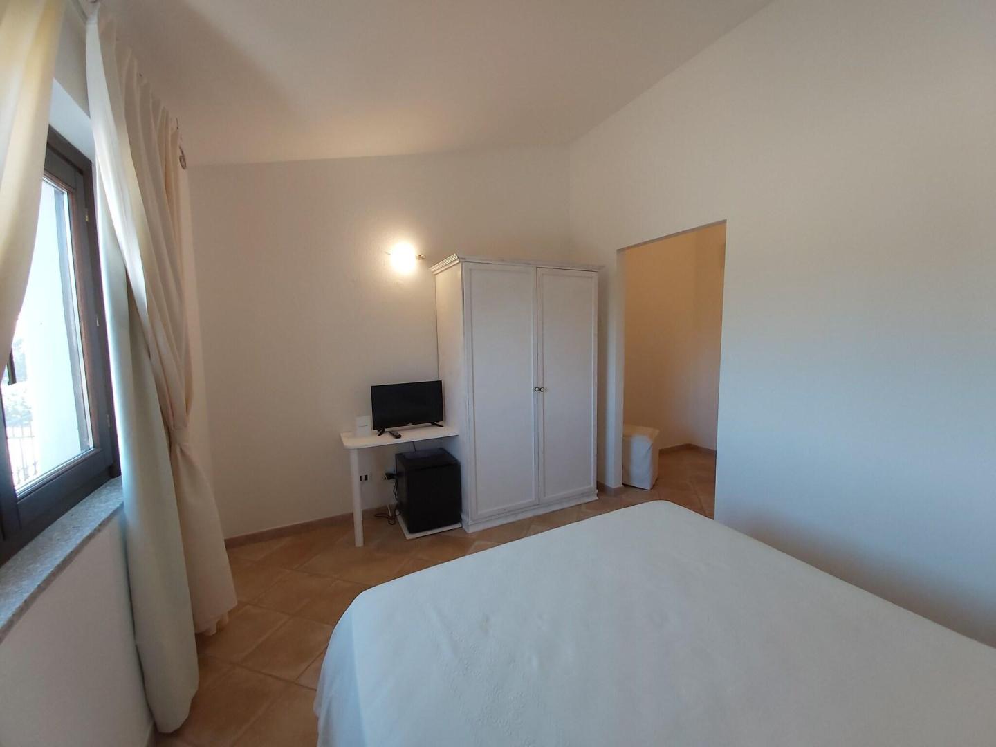 Suite met zithoek — Hotel il Faro di Molara