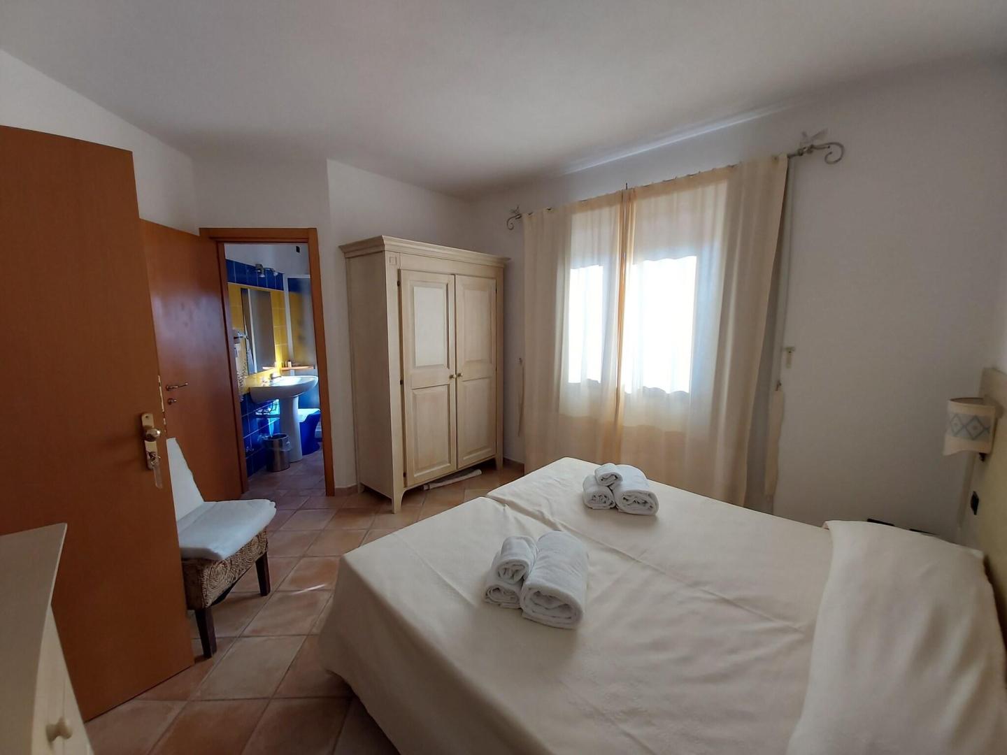 Suite met zithoek — Hotel il Faro di Molara