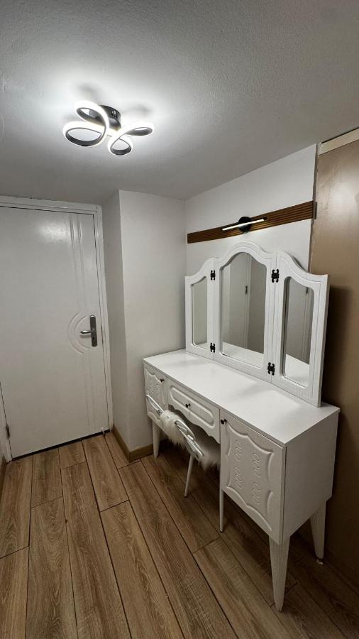 een badkamer met een witte commode met een spiegel bij The Constantine Hotel in Istanbul