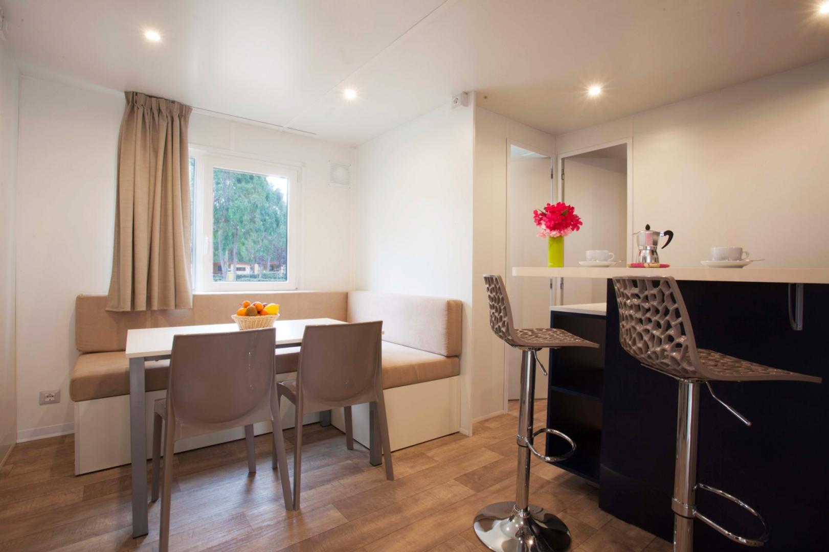Suite met zithoek — Camping Village Laguna Blu