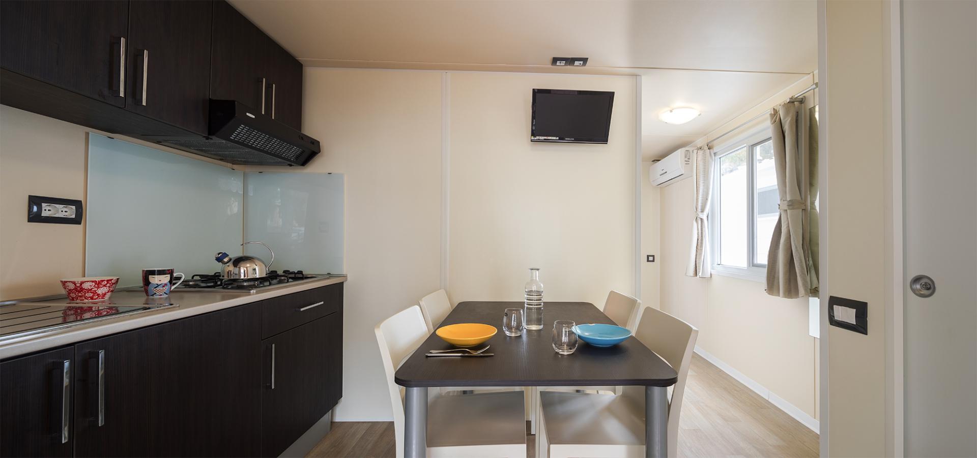 Suite met zithoek — Camping Village Laguna Blu