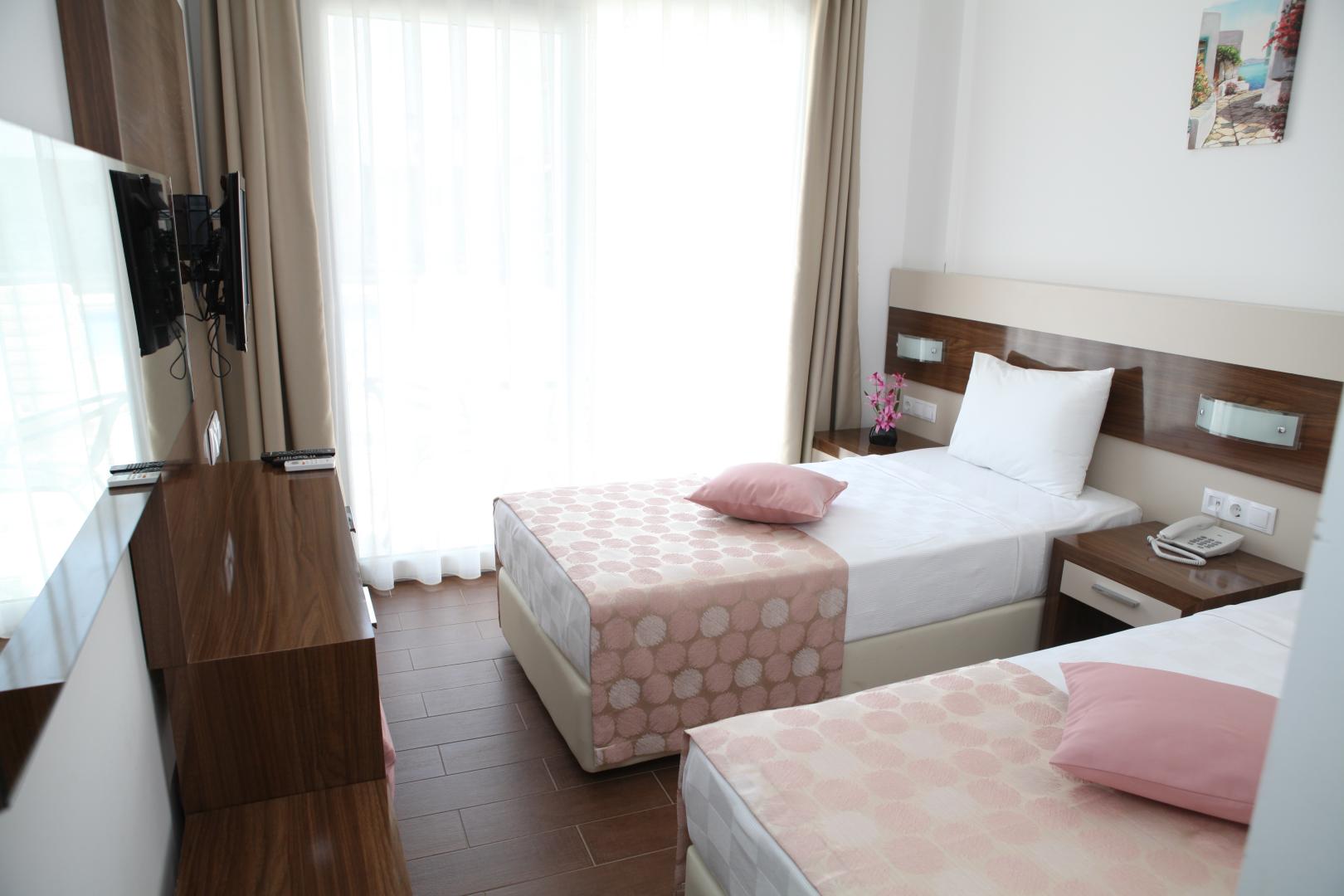 Kamer met twee aparte bedden — Cotton Boutique Hotel