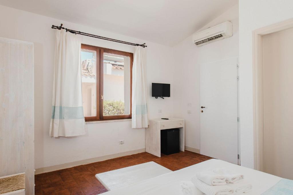 Kamer met balkon — Fior di Sardegna Resort