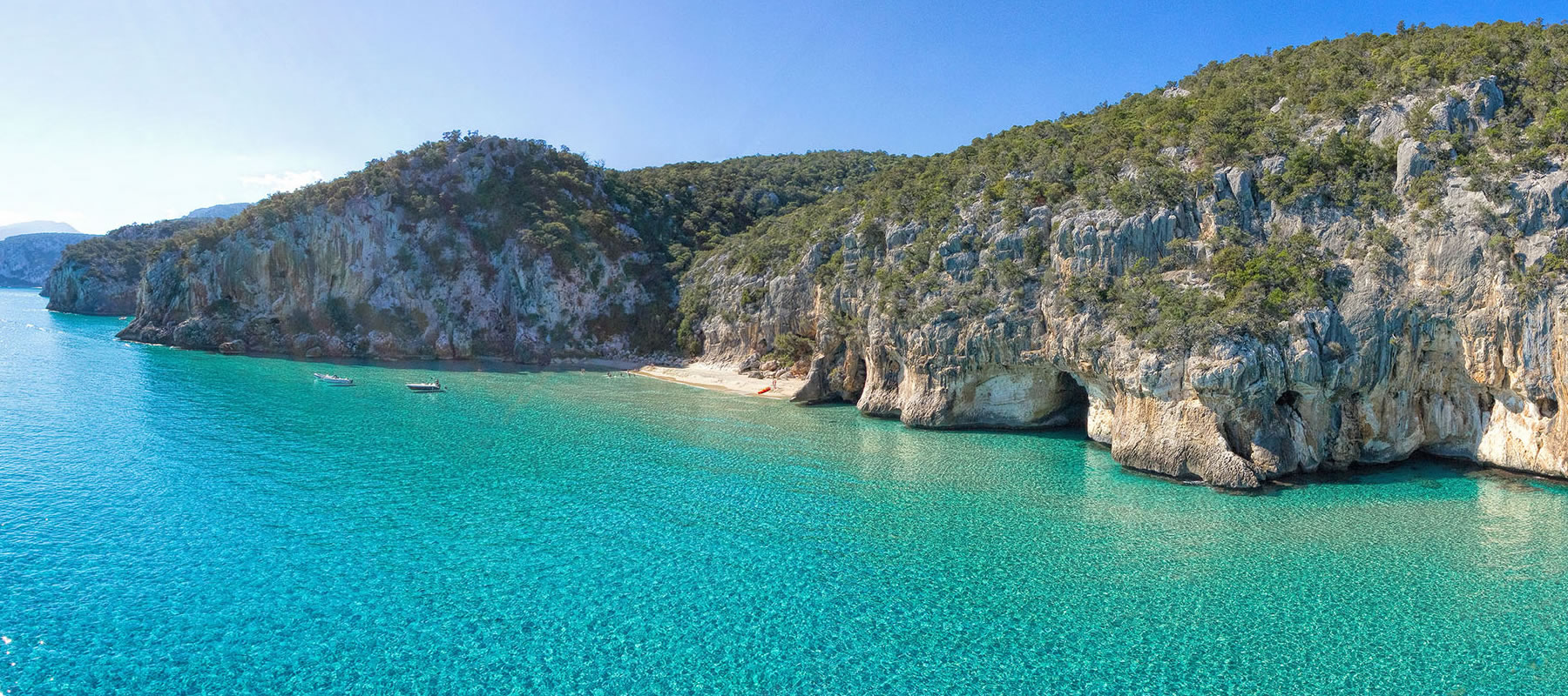 Wit zandstrand met turquoise water — Hotel i Ginepri