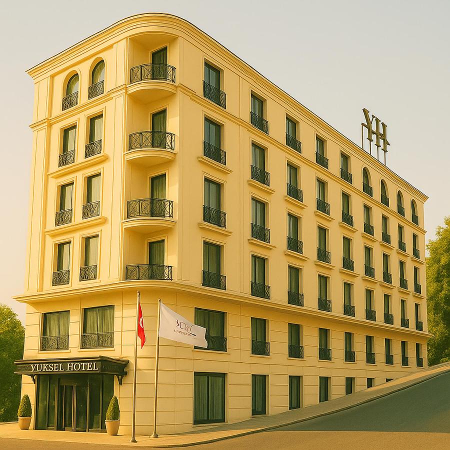 een groot geel gebouw met een vlag ervoor bij Yuksel Istanbul Yenikapı Hotel in Istanbul