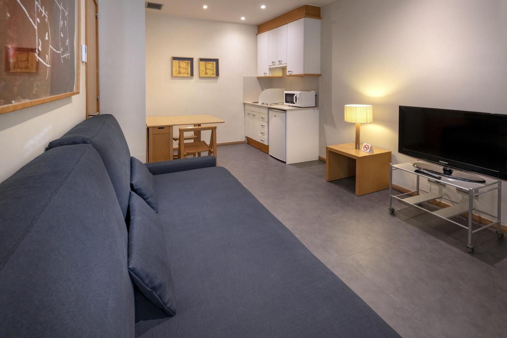Suite met zithoek — Apartamentos Playa de Castelldefels
