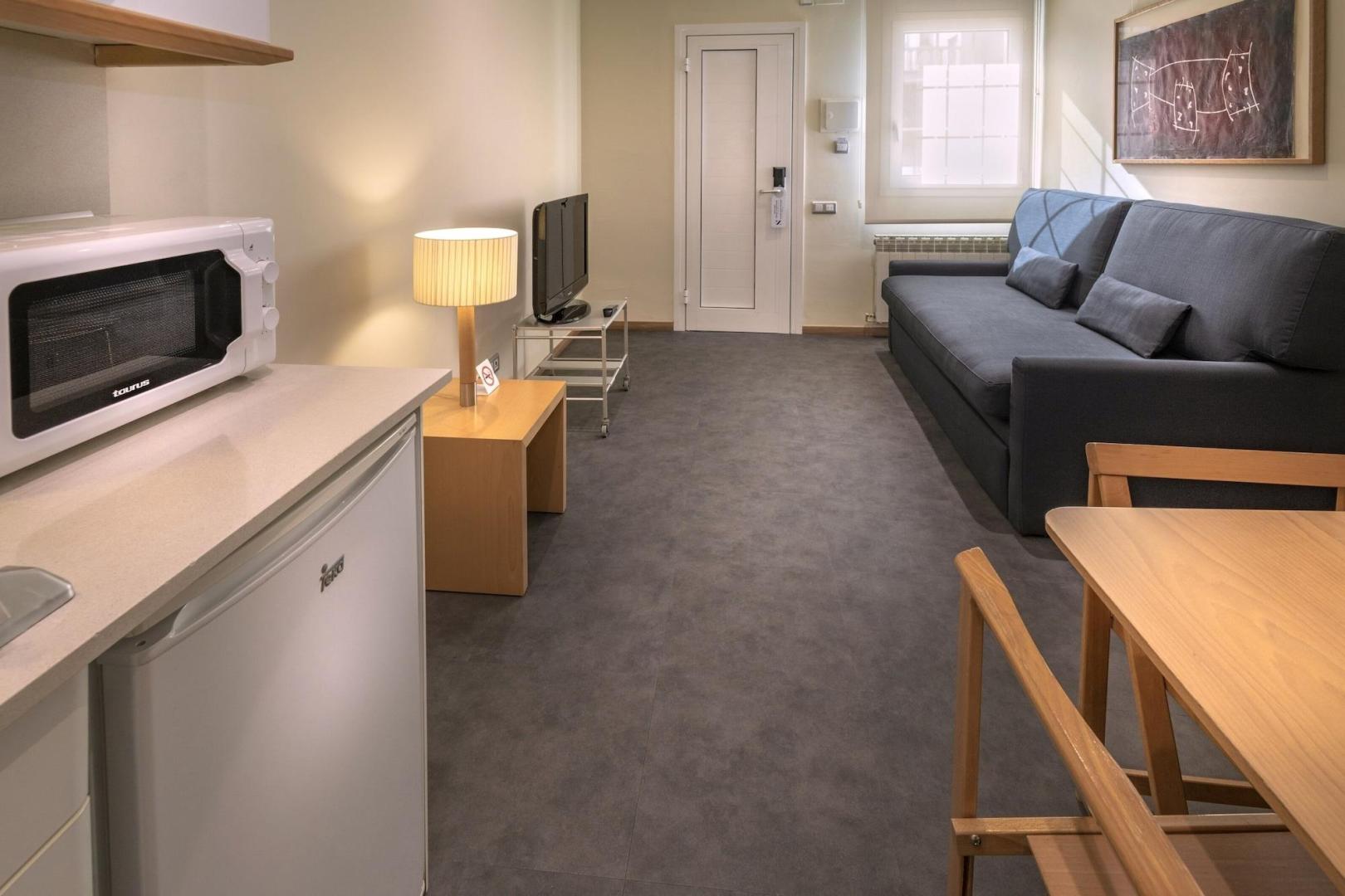 Suite met zithoek — Apartamentos Playa de Castelldefels