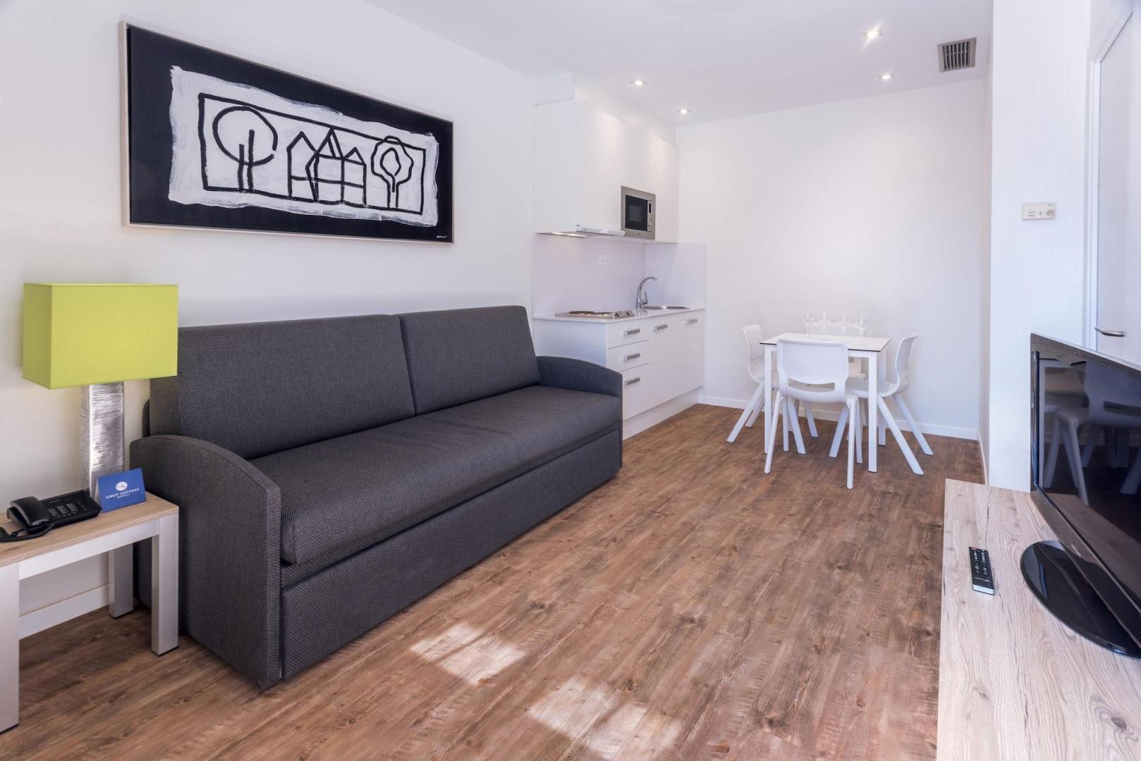 Suite met zithoek — Apartamentos Playa de Castelldefels