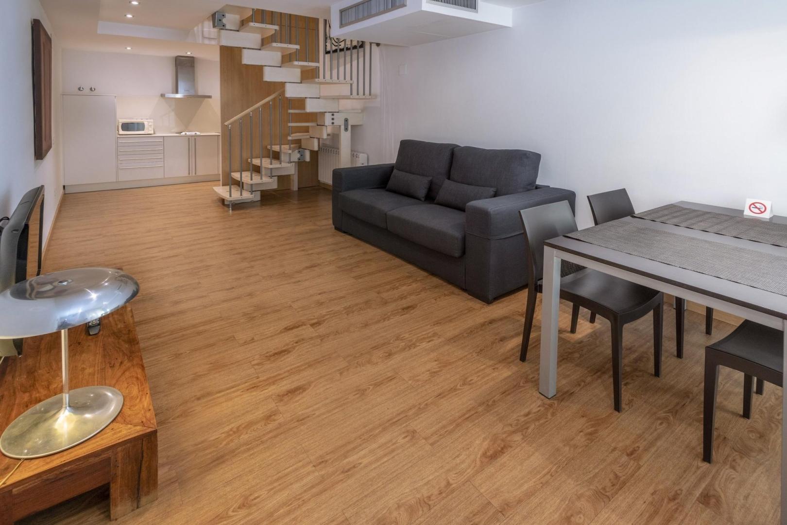 Suite met zithoek — Apartamentos Playa de Castelldefels