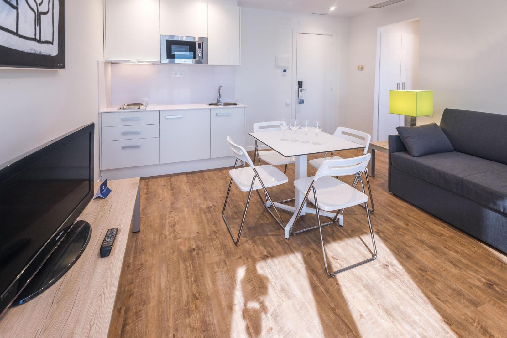 Suite met zithoek — Apartamentos Playa de Castelldefels