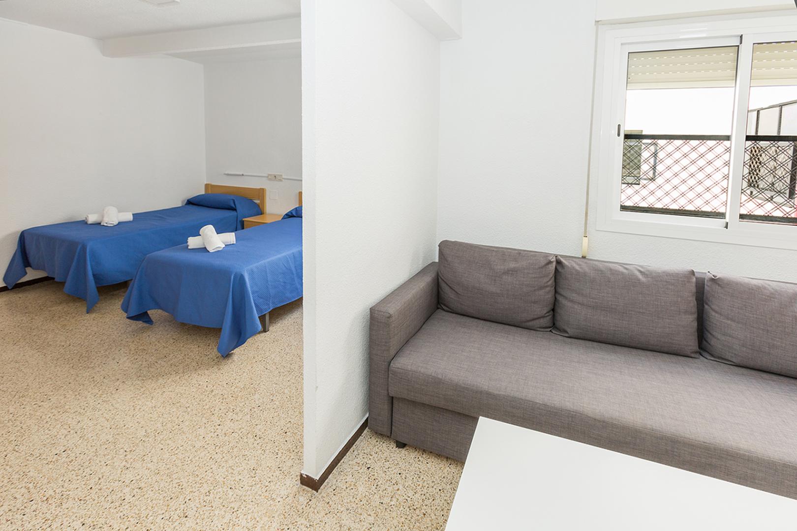 Suite met zithoek — Hostal El Mercat
