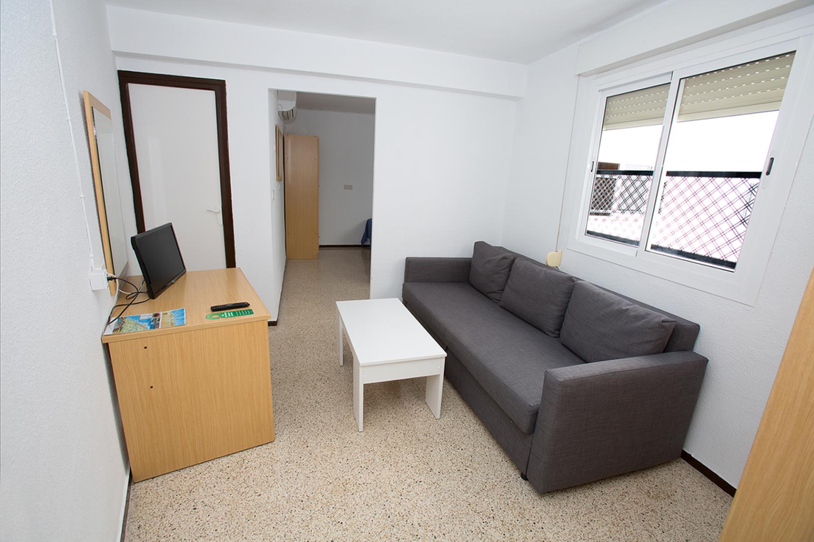 Suite met zithoek — Hostal El Mercat