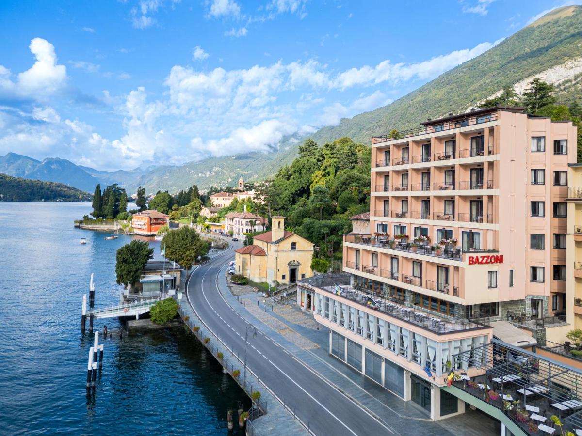 een uitzicht op een stad naast een waterlichaam bij Hotel Bazzoni in Tremezzo