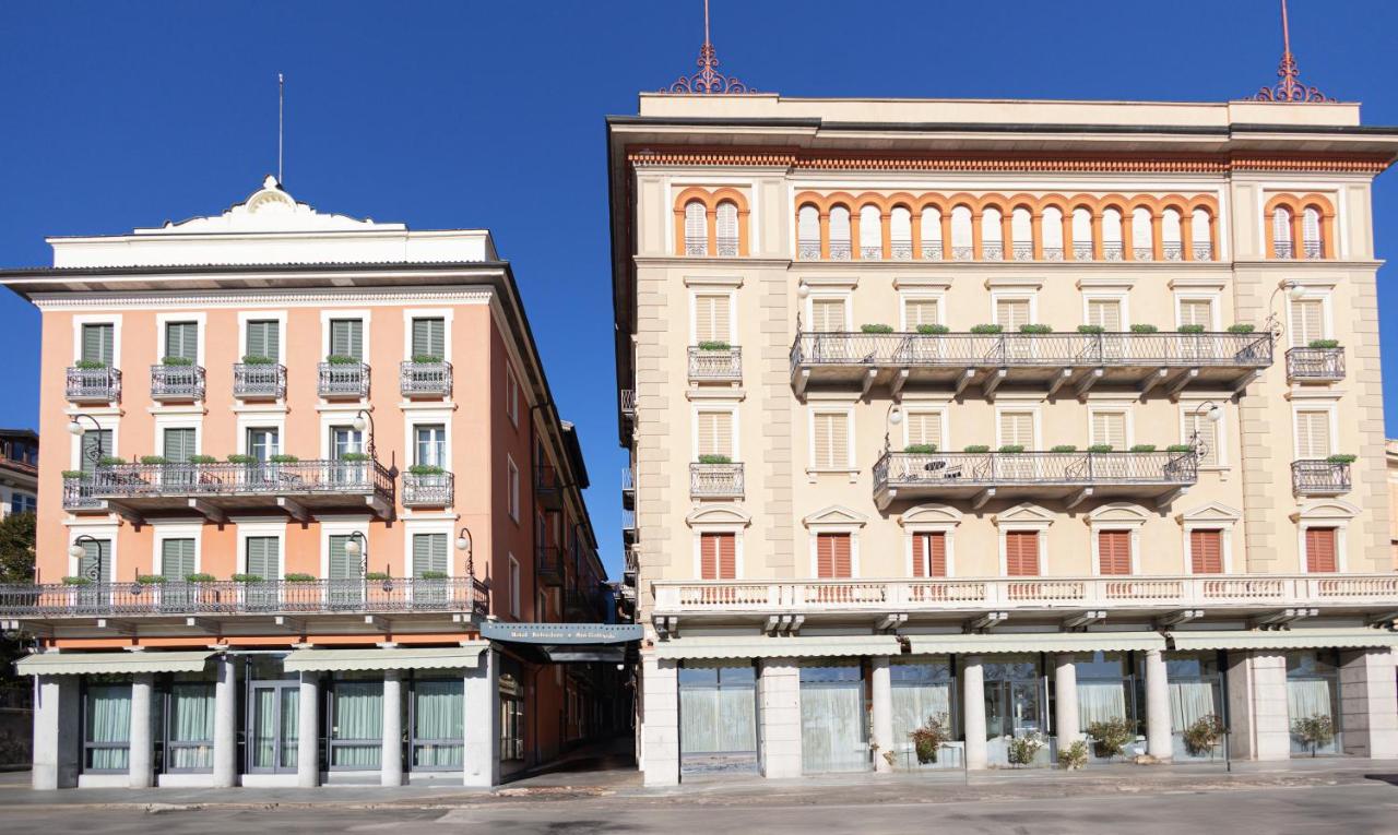 twee gebouwen naast elkaar aan een straat bij LVG Hotel Collection - Belvedere San Gottardo in Verbania